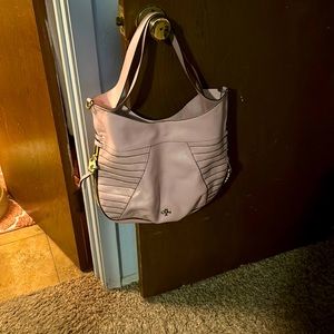 This bag is a soft pink, plush and stylist.  Minimal usage and very soft leather